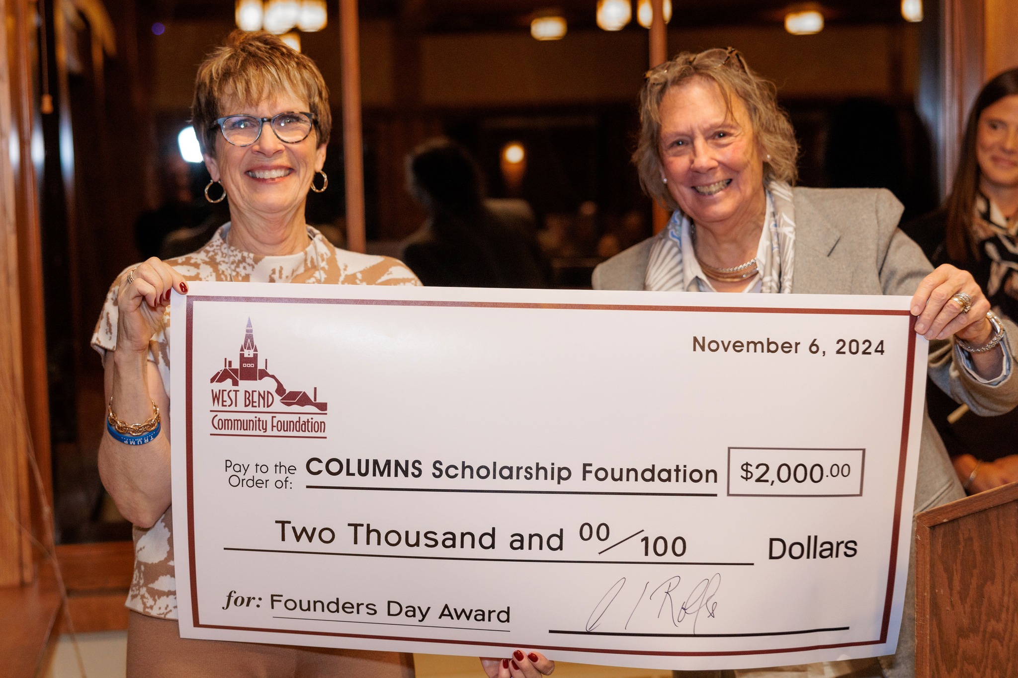 Rose Petitte from West Bend COLUMNS accepts Founders Day Award from Claire Rolfs of the West Bend Community Foundation